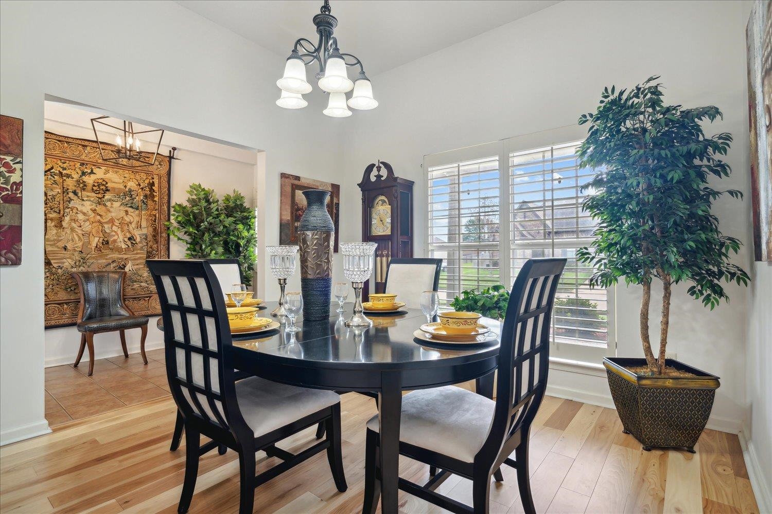 7464 Britt Way Memphis, TN 38125 - Photo 8 of 29 a view of a dining room with furniture and chandelier