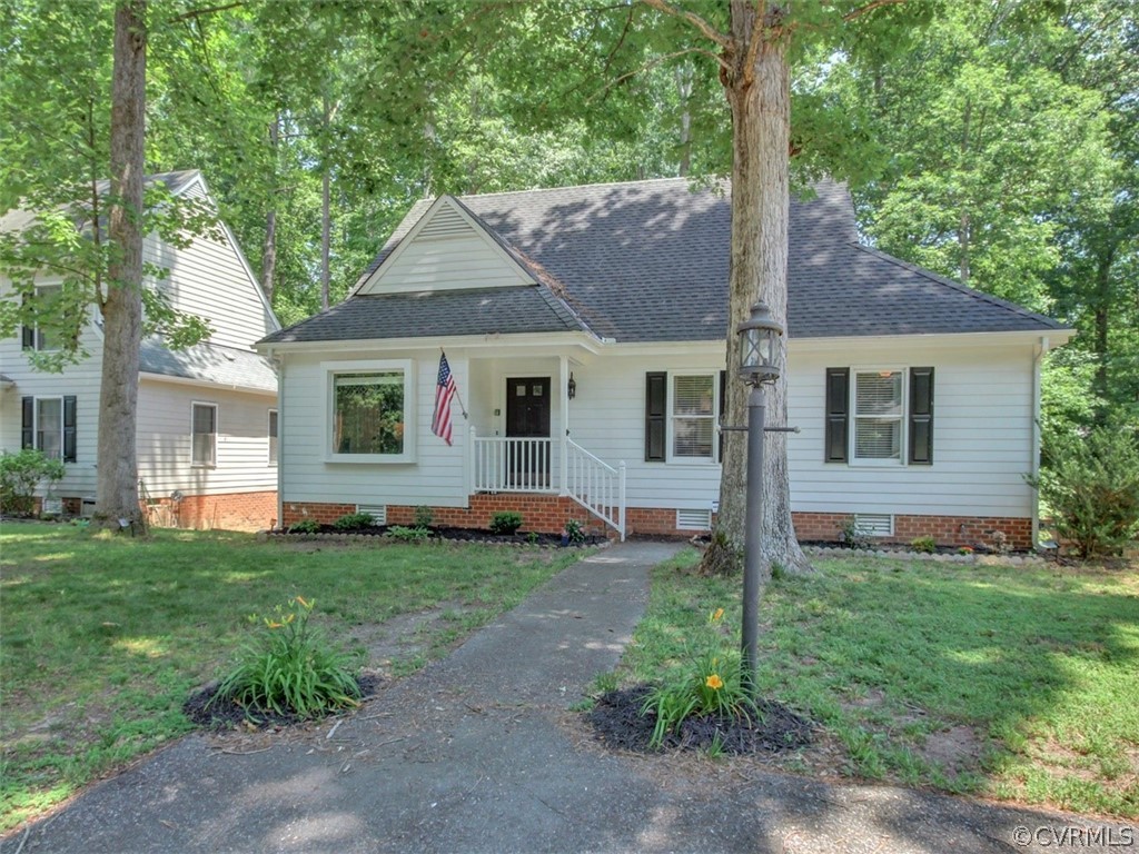 5509 Chatmoss Road Midlothian, VA 23112 - Photo 1 of 38 a view of a yard in front of a house with plants and large tree