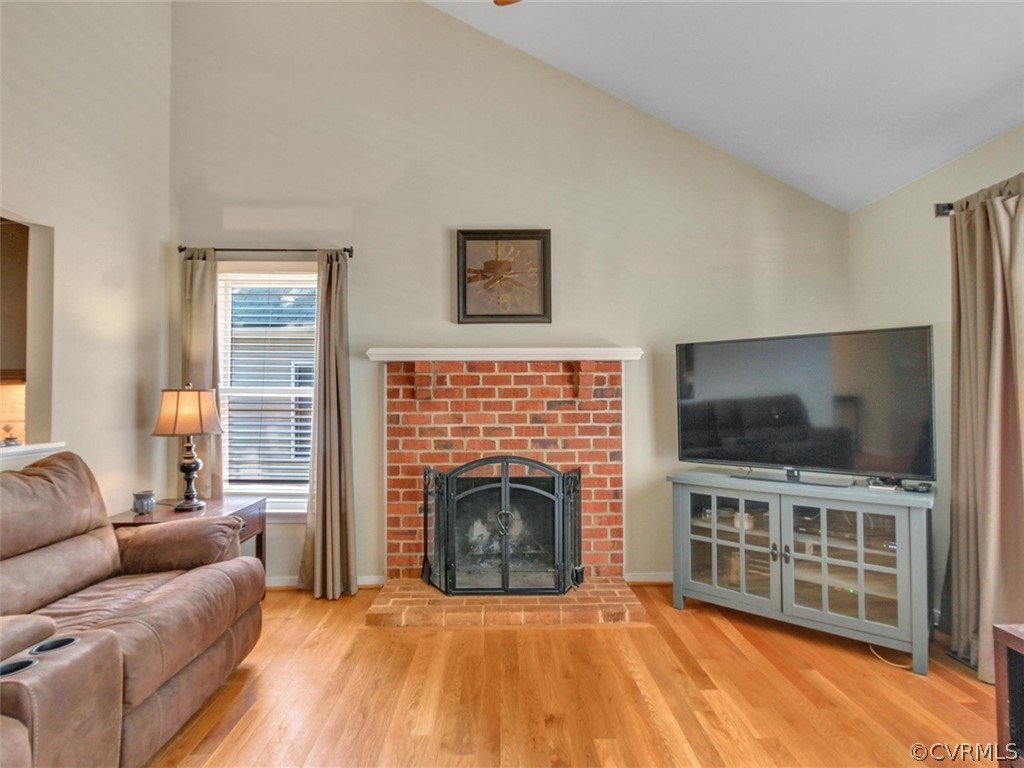 5509 Chatmoss Road Midlothian, VA 23112 - Photo 11 of 38 a living room with a fireplace and a flat screen tv