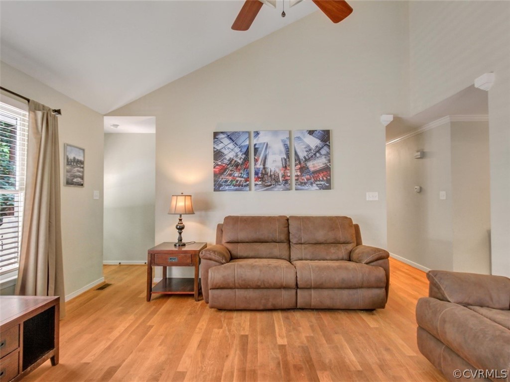 5509 Chatmoss Road Midlothian, VA 23112 - Photo 13 of 38 a living room with furniture and a wooden floor