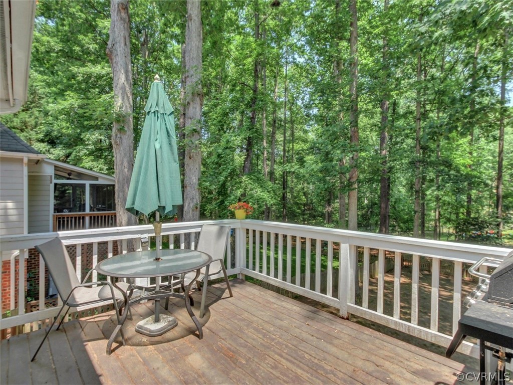 5509 Chatmoss Road Midlothian, VA 23112 - Photo 22 of 38 a view of a deck with a table and chairs with wooden floor