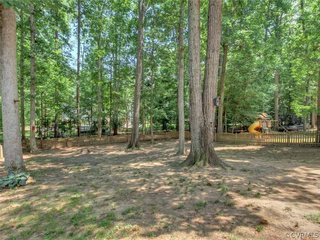 5509 Chatmoss Road Midlothian, VA 23112 - Photo 24 of 38 a view of a tree in the middle of a yard