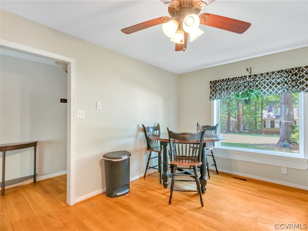 5509 Chatmoss Road Midlothian, VA 23112 - Photo 7 of 38 a view of a dining room with furniture wooden floor and chandelier