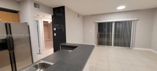 a view of an empty room with a fireplace