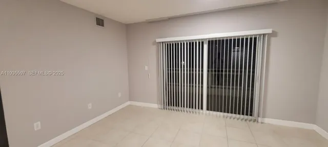 a view of a room that has a window in it