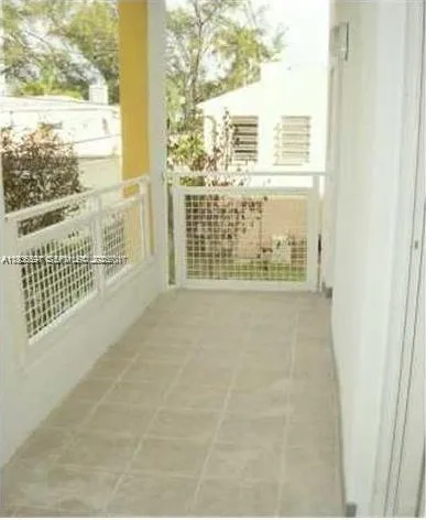 a view of a balcony with a floor to ceiling window