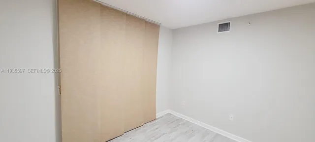 a view of empty room with windows