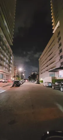 a view of balcony and yard
