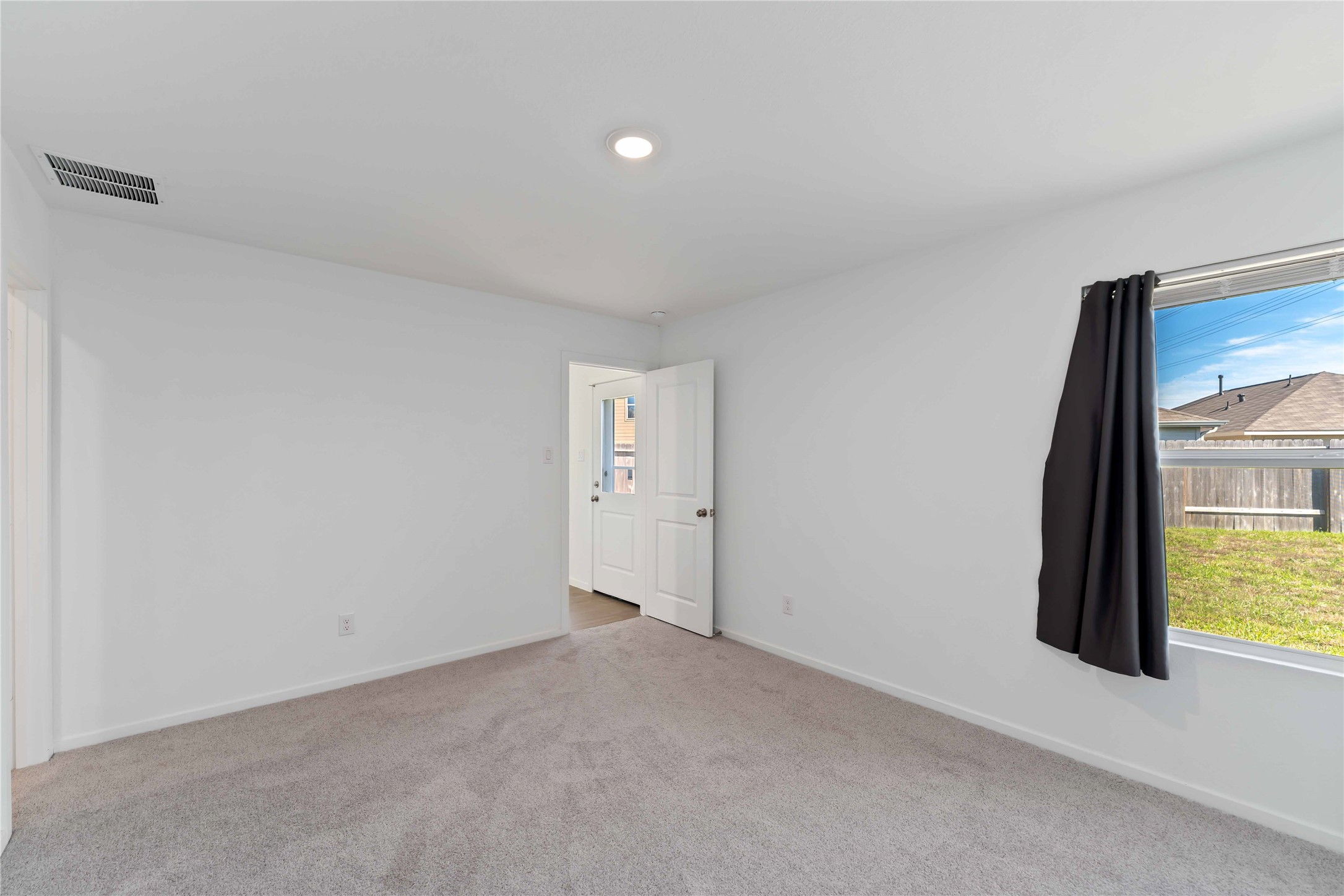 21002 Longwitton Lane Humble, TX 77338 - Photo 13 of 26 a view of an empty room and a window