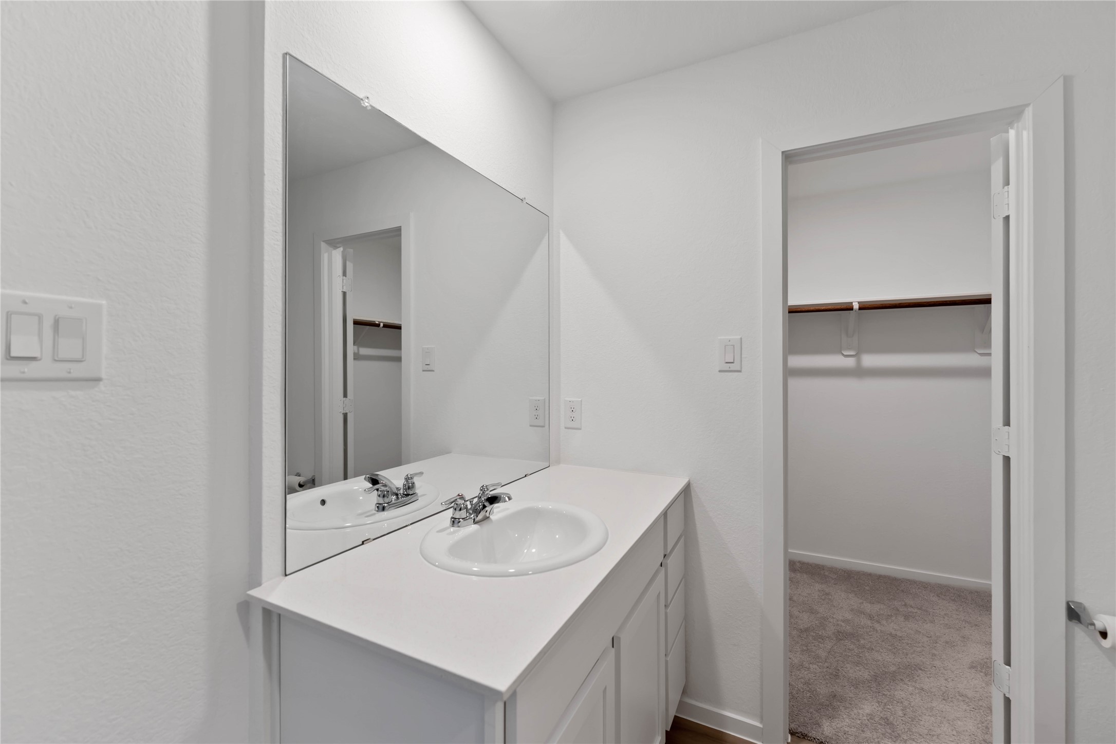 21002 Longwitton Lane Humble, TX 77338 - Photo 15 of 26 a bathroom with a sink and a mirror