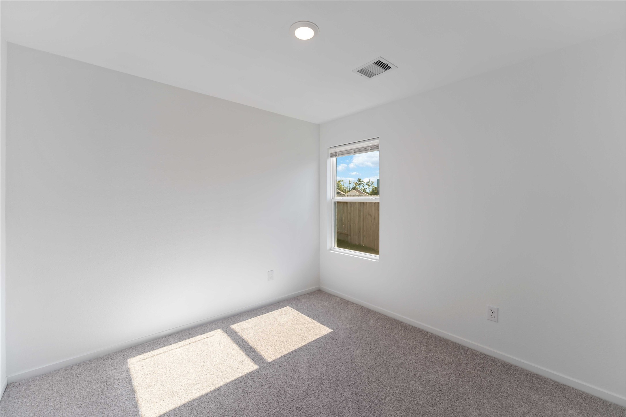 21002 Longwitton Lane Humble, TX 77338 - Photo 19 of 26 an empty room with a window