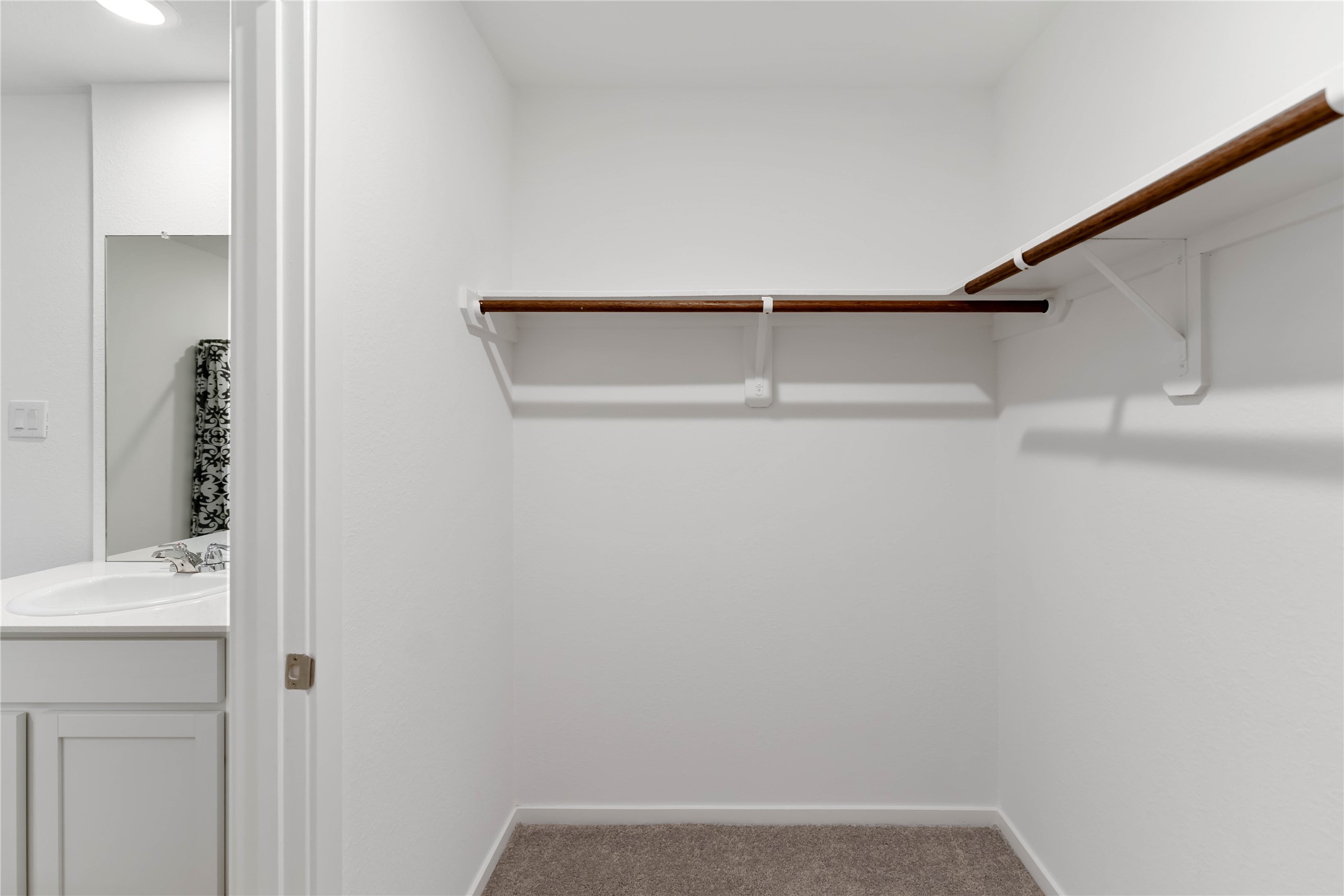 21002 Longwitton Lane Humble, TX 77338 - Photo 23 of 26 a view of small space with racks on the wall