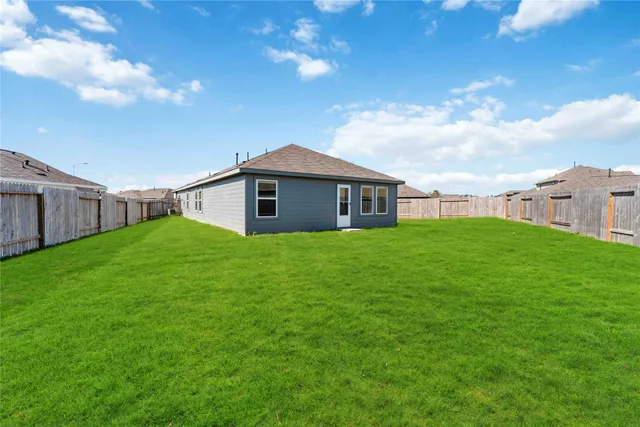 a view of a house with a back yard