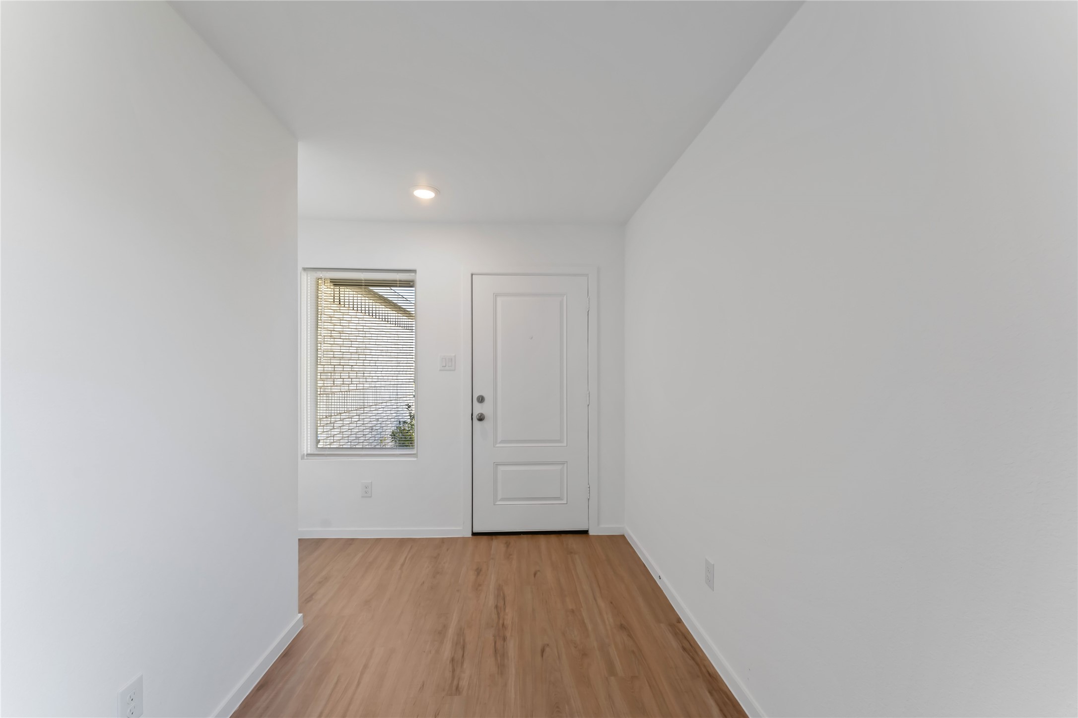 21002 Longwitton Lane Humble, TX 77338 - Photo 3 of 26 a view of a hallway with wooden floor