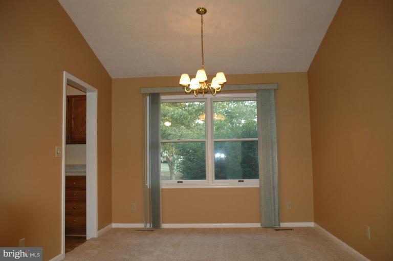 Dining Room with vaulted ceiling