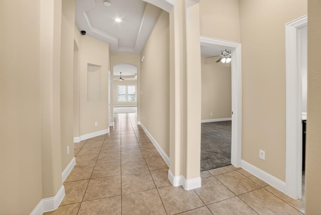 552 Winnetka Drive Oak Point, TX 75068 - Photo 4 of 40 a view of a hallway with a wooden cabinets
