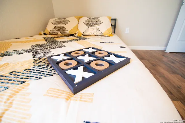 a bedroom with a bed and a couch