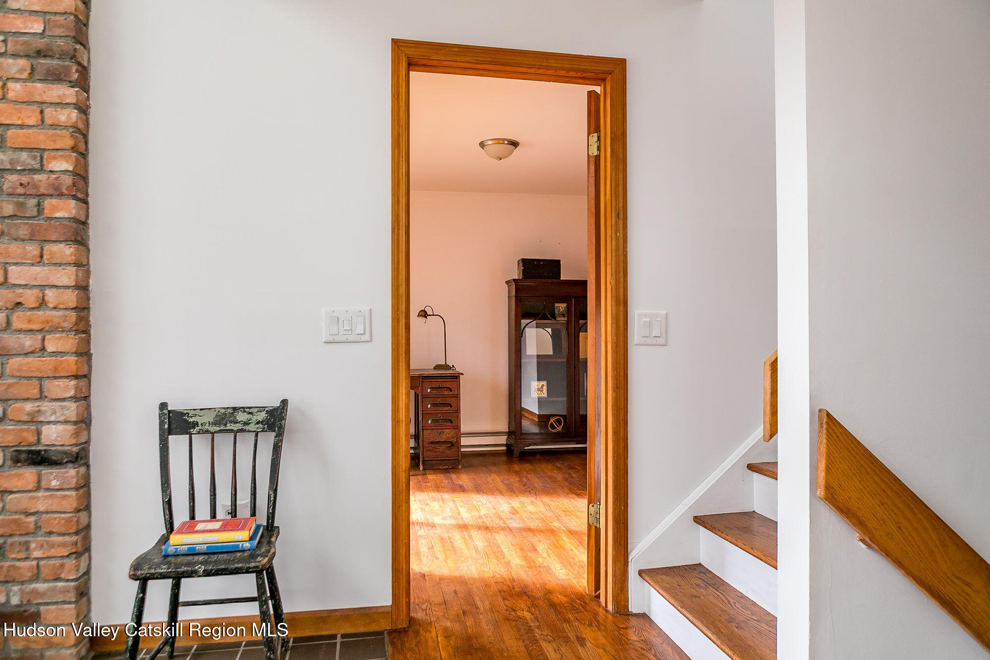 446 Abbey Road Woodstock, NY 12457 - Photo 14 of 32 a view of a hallway with wooden floor and a bathroom