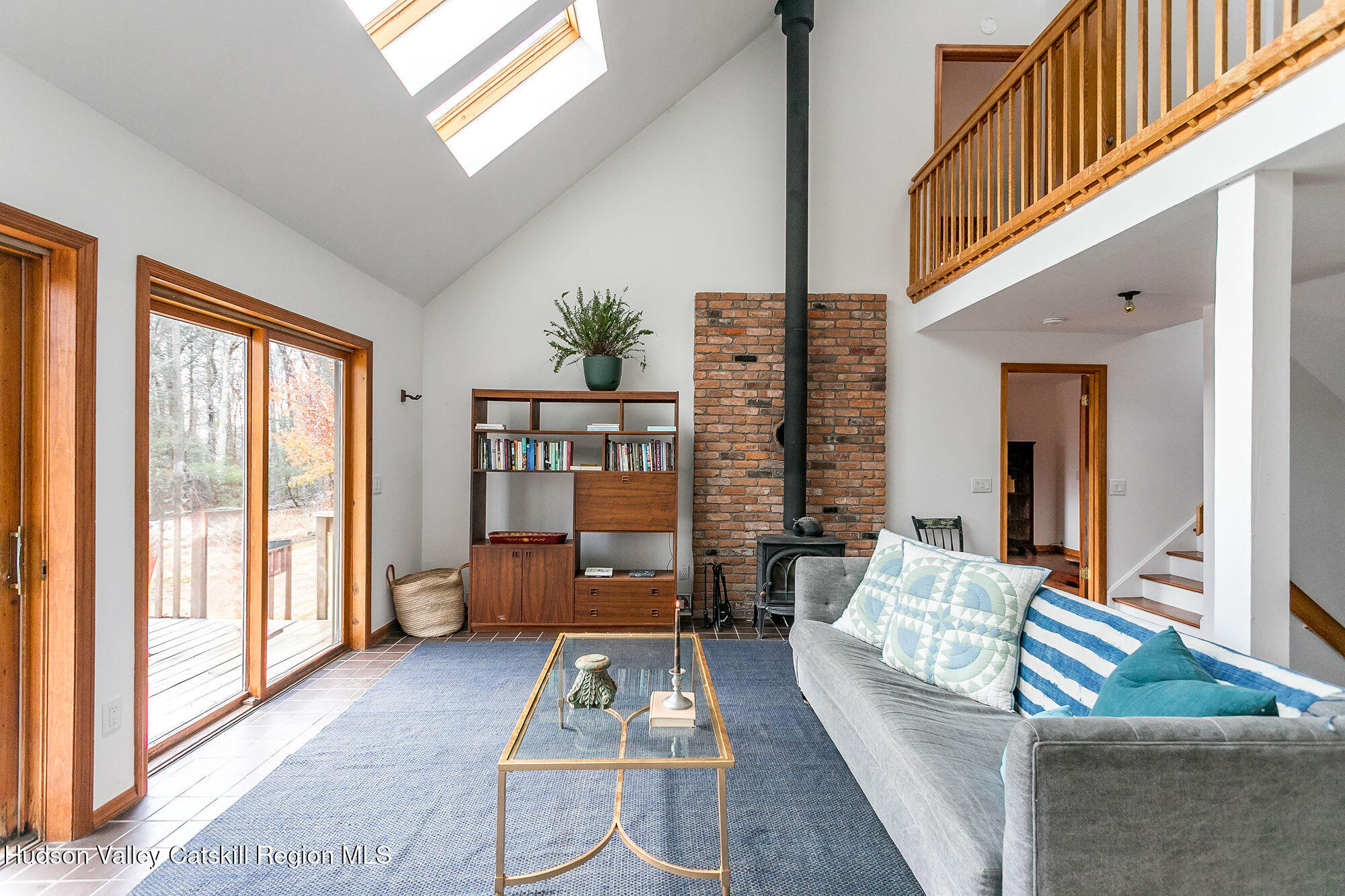 446 Abbey Road Woodstock, NY 12457 - Photo 2 of 32 a living room with furniture and a floor to ceiling window