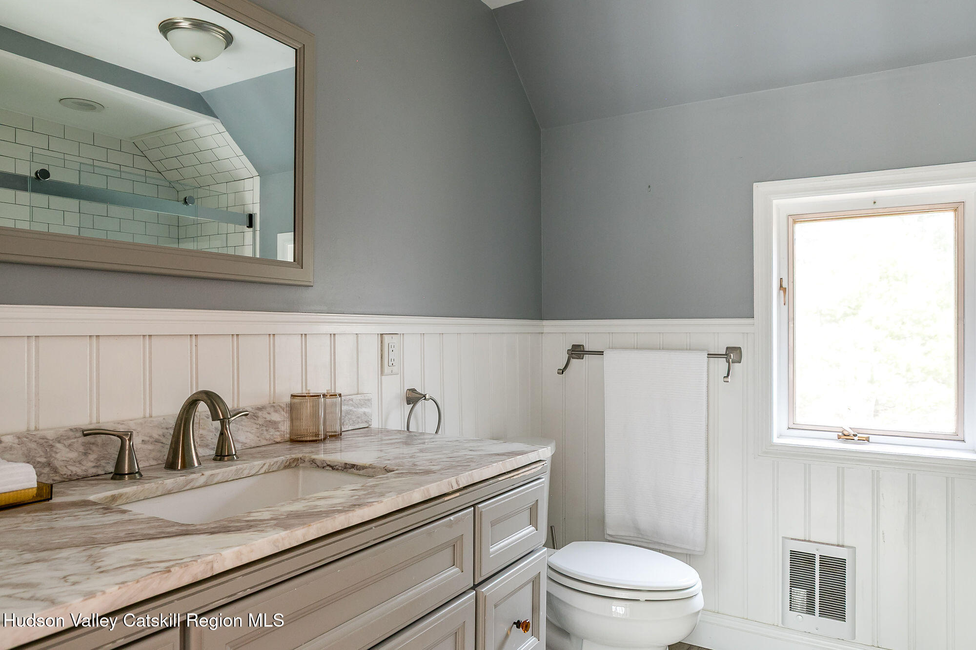 446 Abbey Road Woodstock, NY 12457 - Photo 21 of 32 a bathroom with a granite countertop toilet sink and mirror