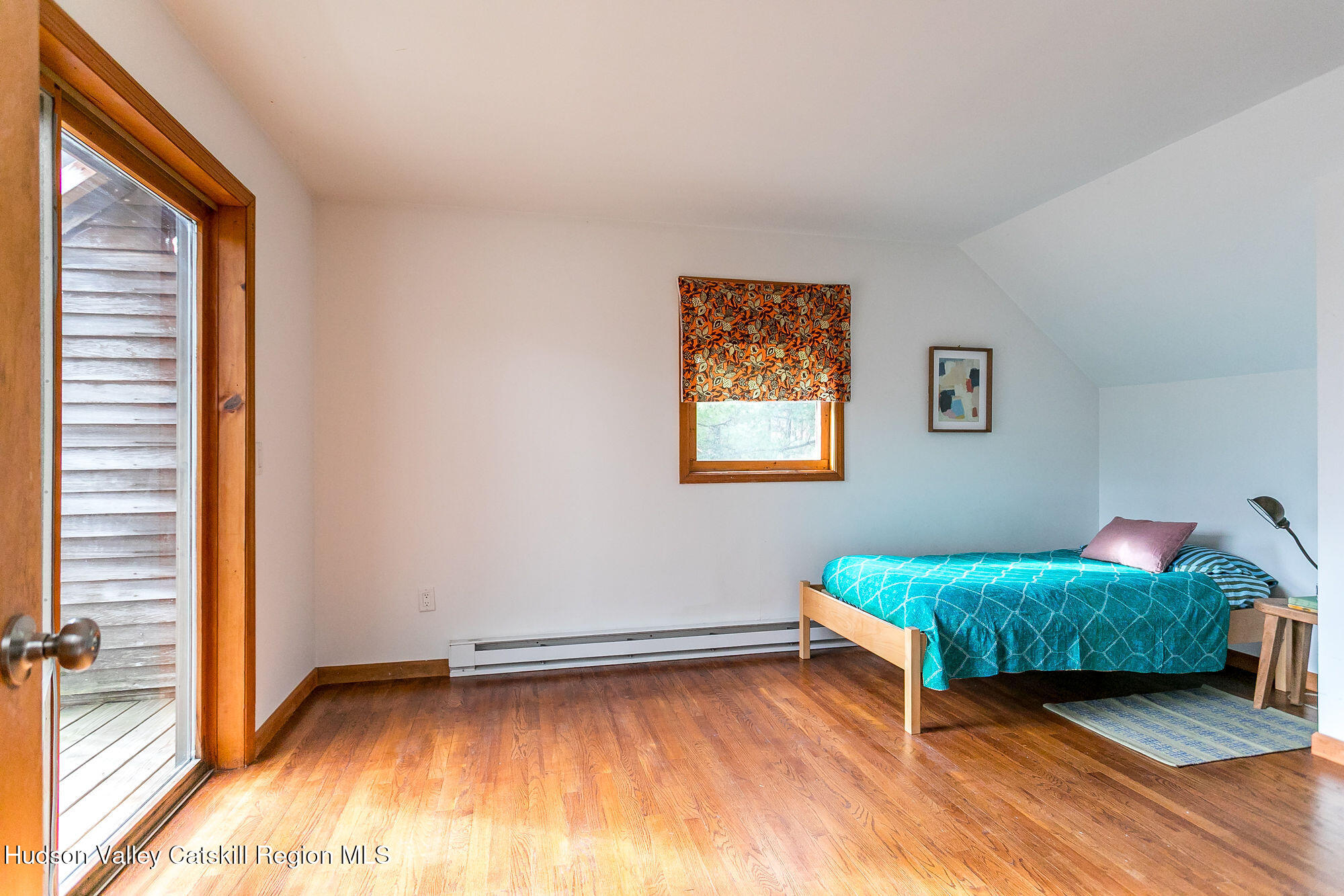 446 Abbey Road Woodstock, NY 12457 - Photo 22 of 32 a room with a bed and a window