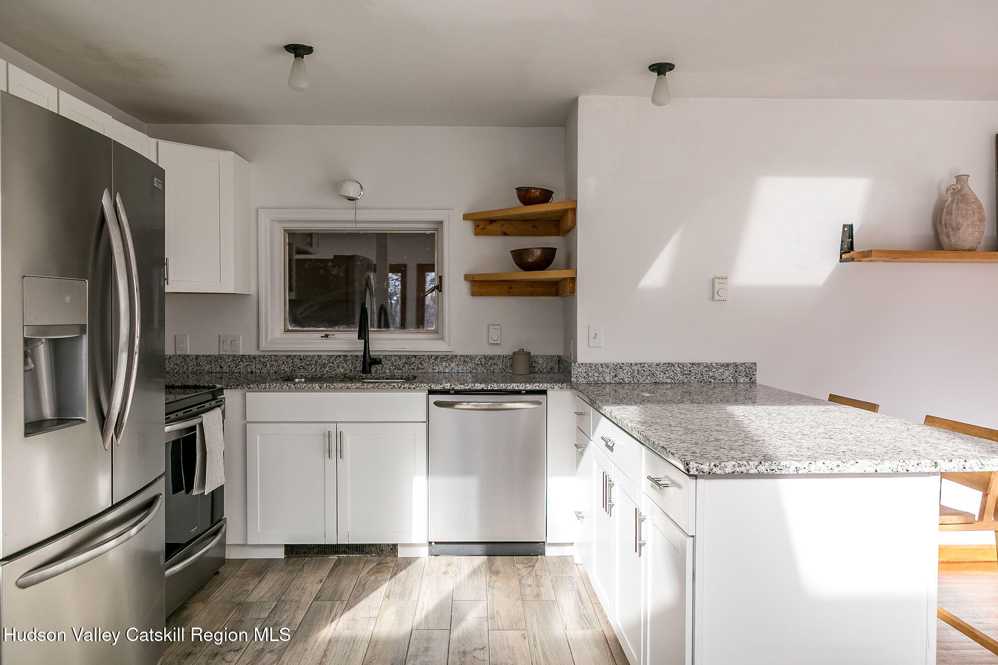 446 Abbey Road Woodstock, NY 12457 - Photo 10 of 32 a kitchen with stainless steel appliances granite countertop a sink stove and refrigerator