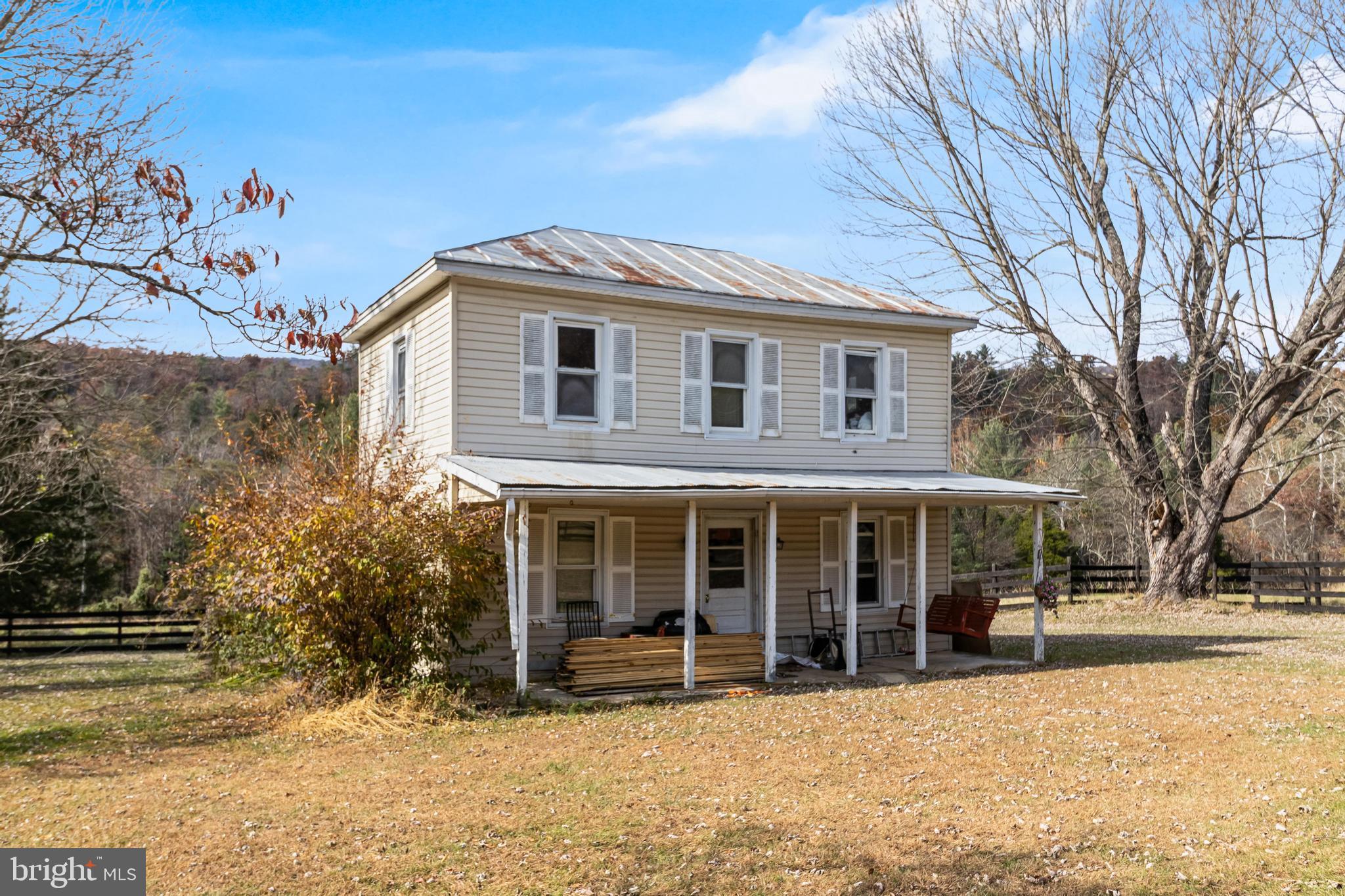 19442 Runions Creek Road Broadway, VA 22815 - Photo 2 of 24 a front view of a house with a yard covered in snow