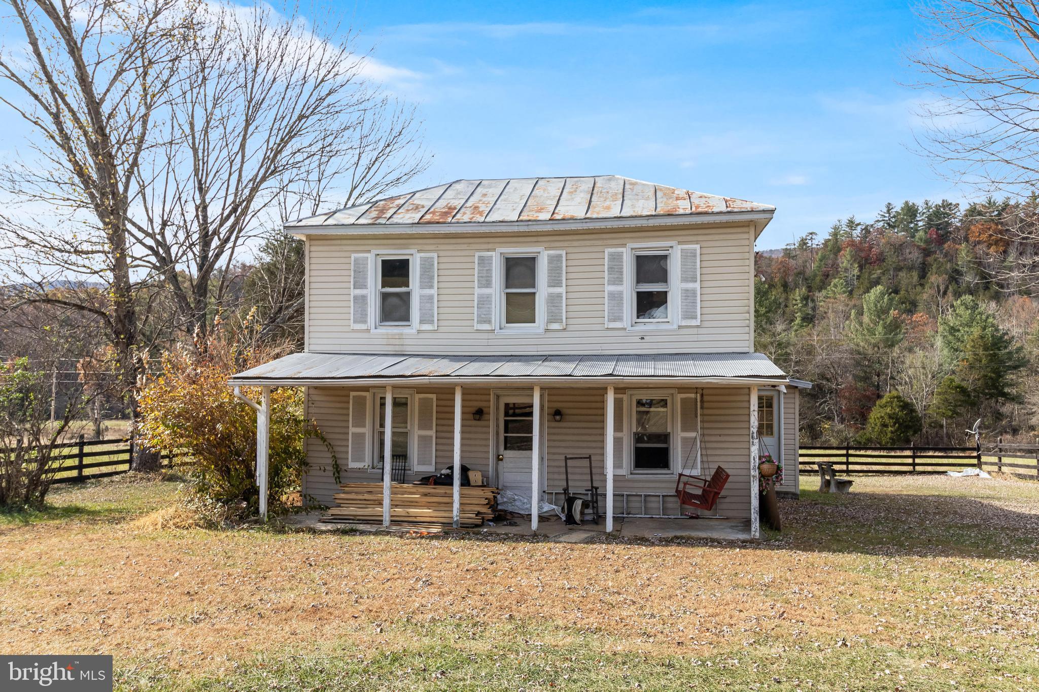 19442 Runions Creek Road Broadway, VA 22815 - Photo 3 of 24 a front view of a house with a yard covered in snow