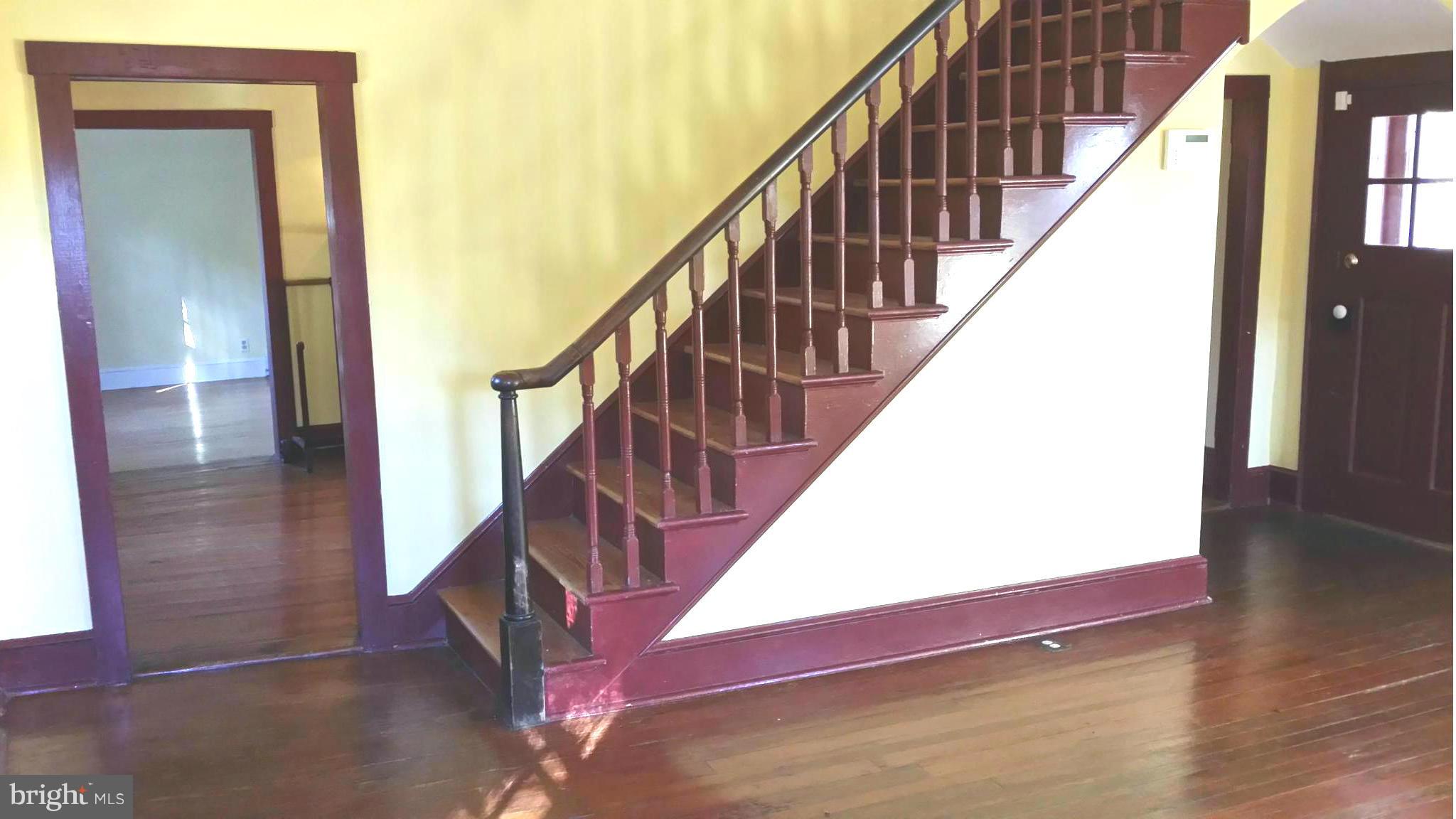1550 Bishop Meade Road Boyce, VA 22620 - Photo 15 of 24 a view of staircase with wooden floor and white walls