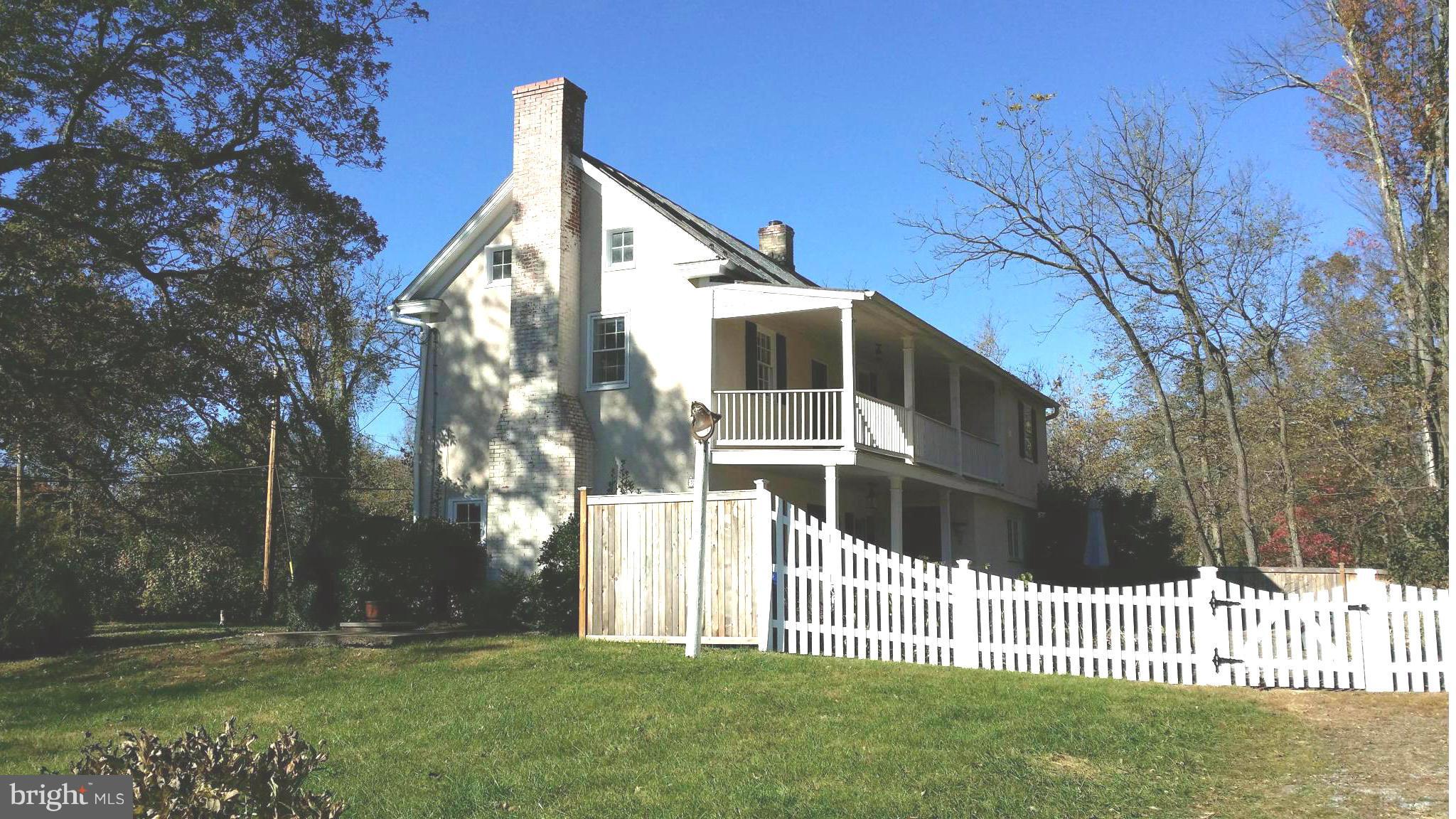 1550 Bishop Meade Road Boyce, VA 22620 - Photo 4 of 24 a front view of a house with a yard