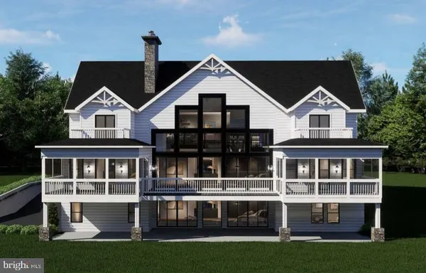 a front view of a house with a garden and yard