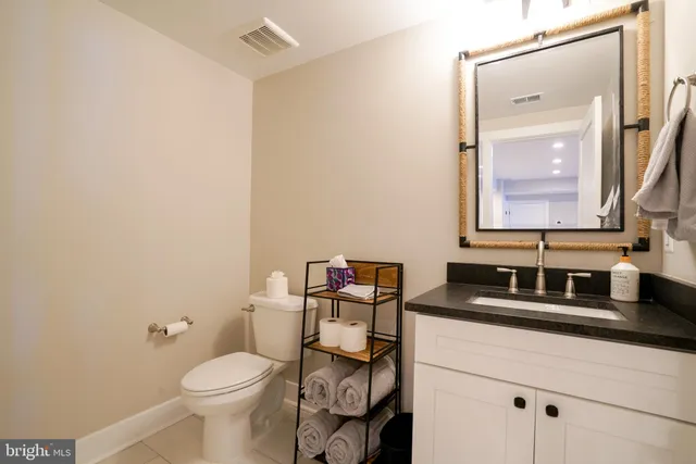 a bedroom with two beds and a window