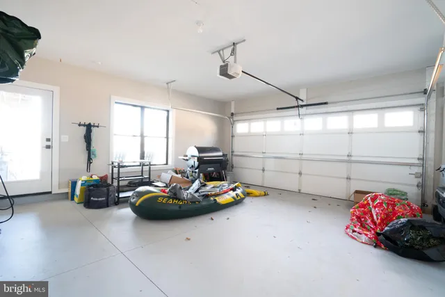 a living room with furniture a fireplace and a chandelier