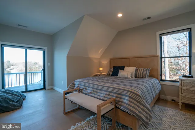 a living room with furniture window and a flat screen tv
