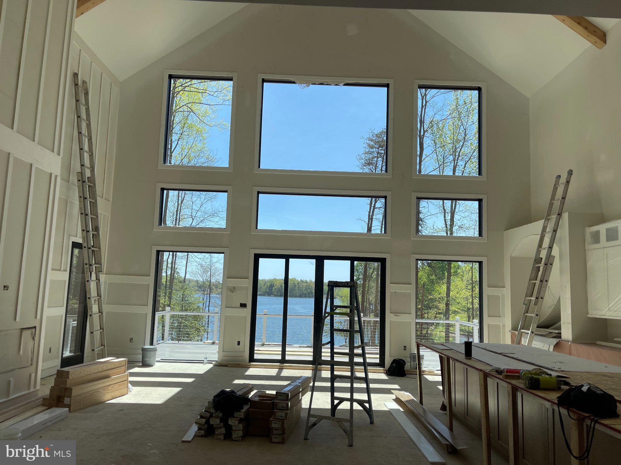 290 Carrs Bridge Road Mineral, VA 23117 - Photo 37 of 38 a living room filled with furniture and a floor to ceiling window