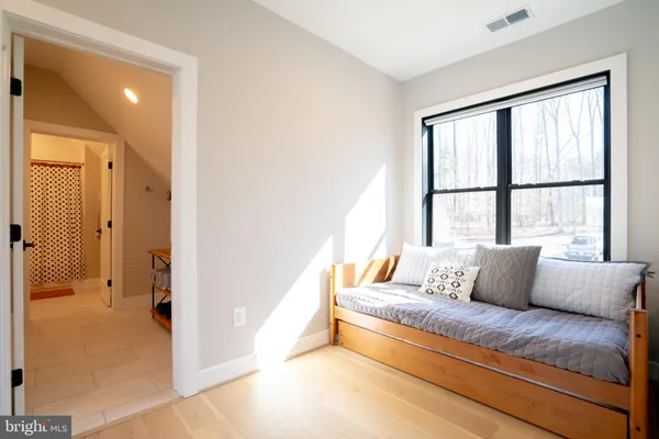 a view of a house with backyard swimming pool and sitting area
