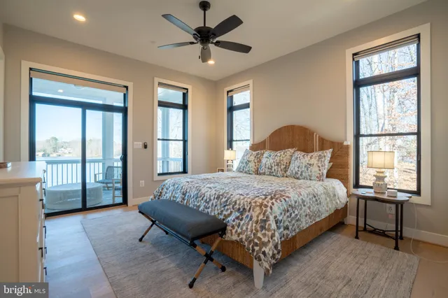 a living room with furniture kitchen view and a flat screen tv