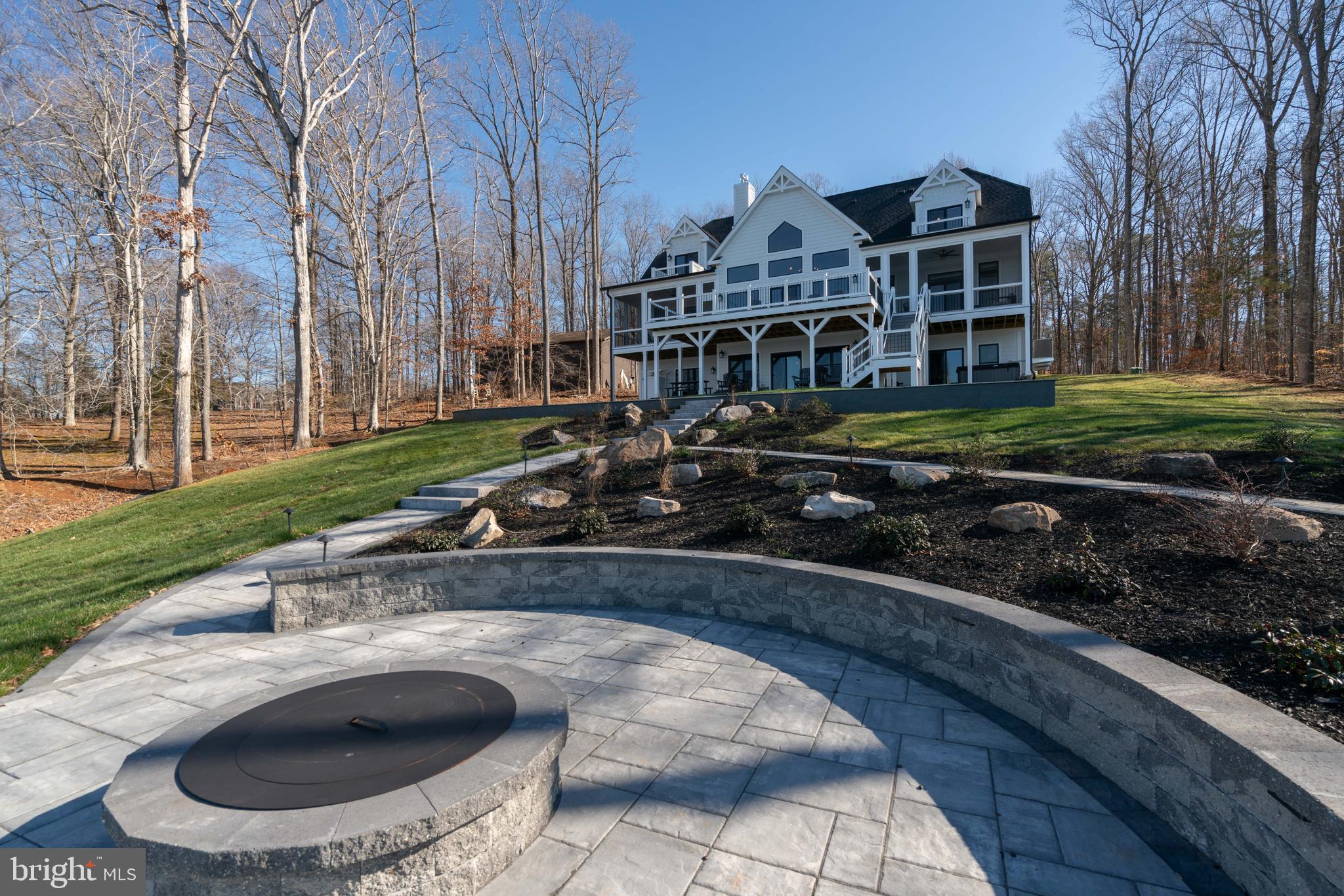 290 Carrs Bridge Road Mineral, VA 23117 - Photo 78 of 101 a view of a house with backyard swimming pool and sitting area