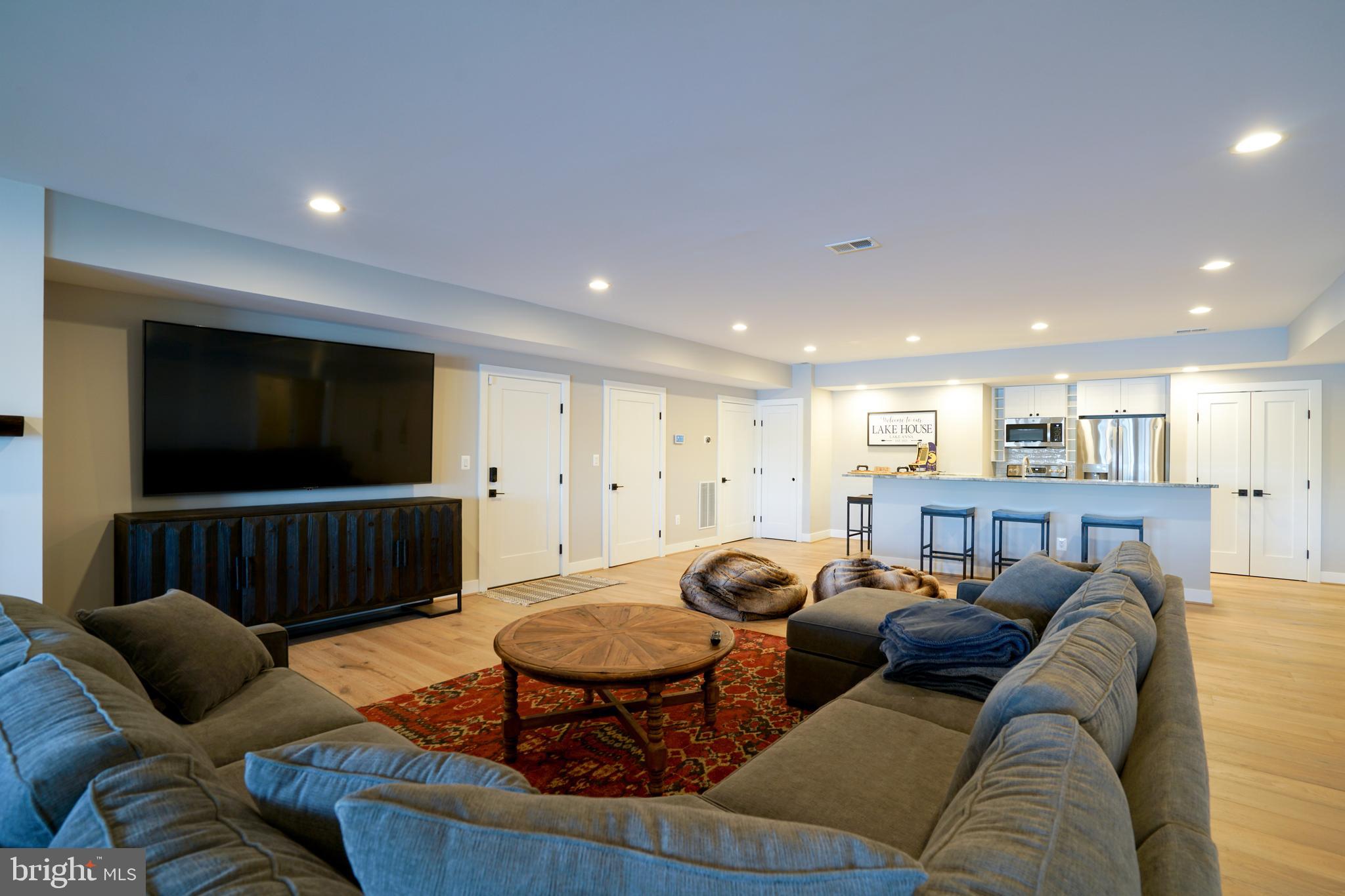 290 Carrs Bridge Road Mineral, VA 23117 - Photo 98 of 101 a living room with furniture kitchen view and a flat screen tv