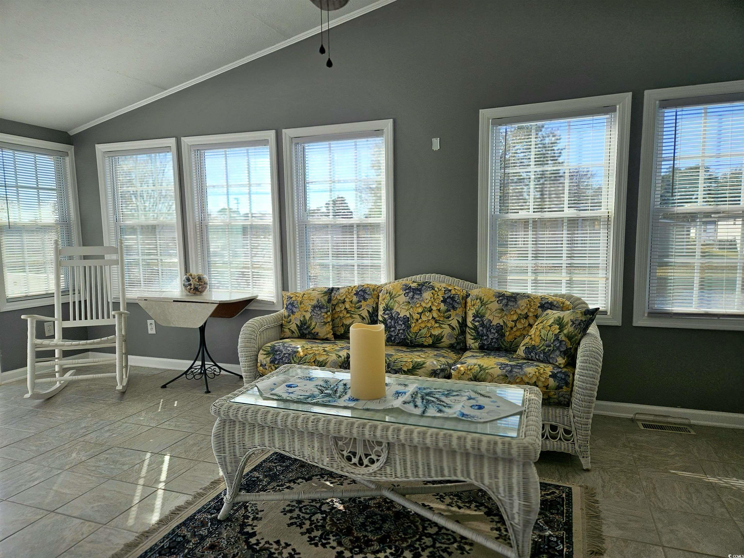 471 Meadowlark Surfside Beach, SC 29575 - Photo 11 of 40 Sunroom / solarium with healthy amount of natural light and lofted ceiling