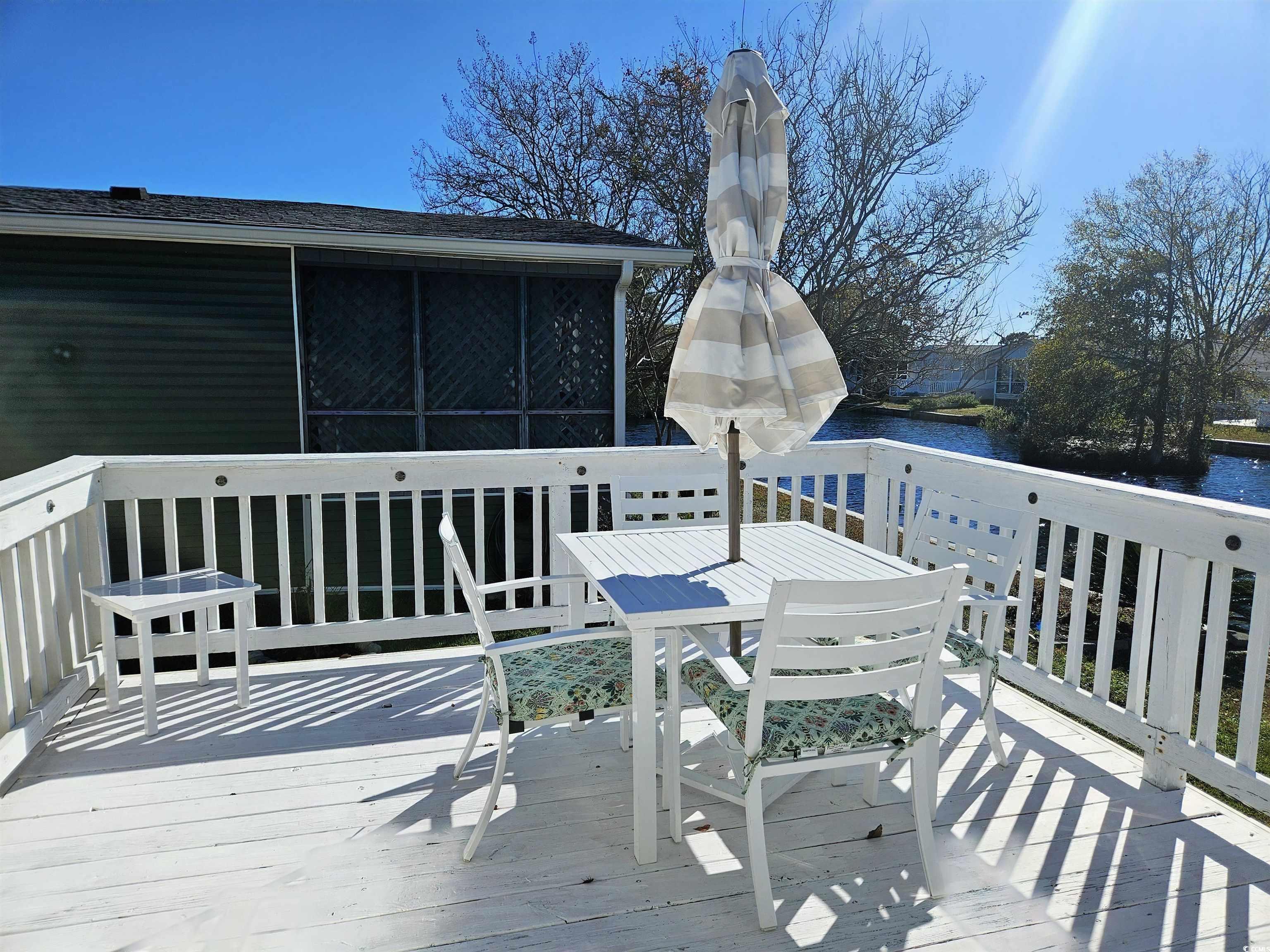471 Meadowlark Surfside Beach, SC 29575 - Photo 13 of 40 Deck featuring outdoor dining space and a water view