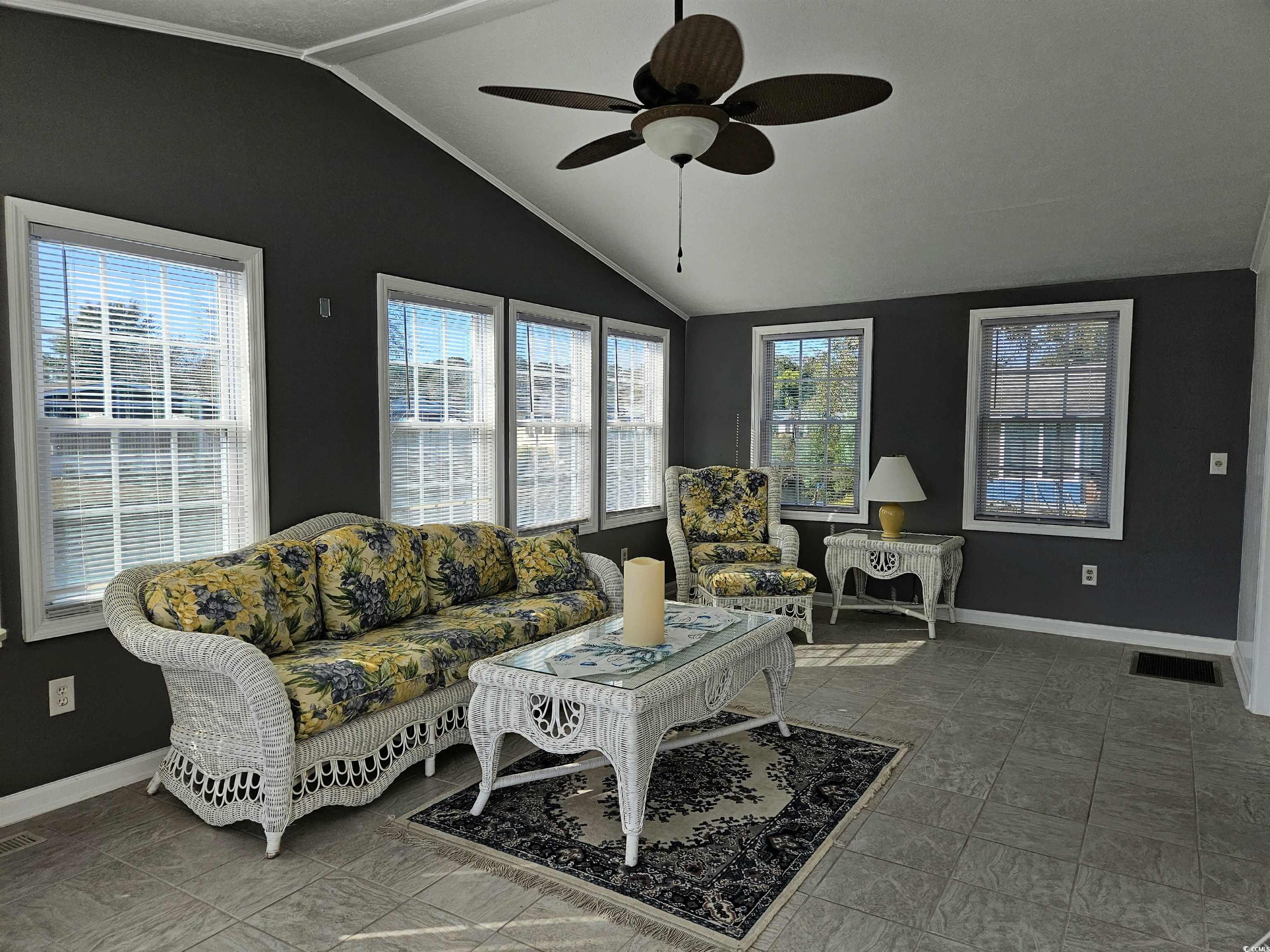 471 Meadowlark Surfside Beach, SC 29575 - Photo 15 of 40 Living area with vaulted ceiling and a ceiling fan
