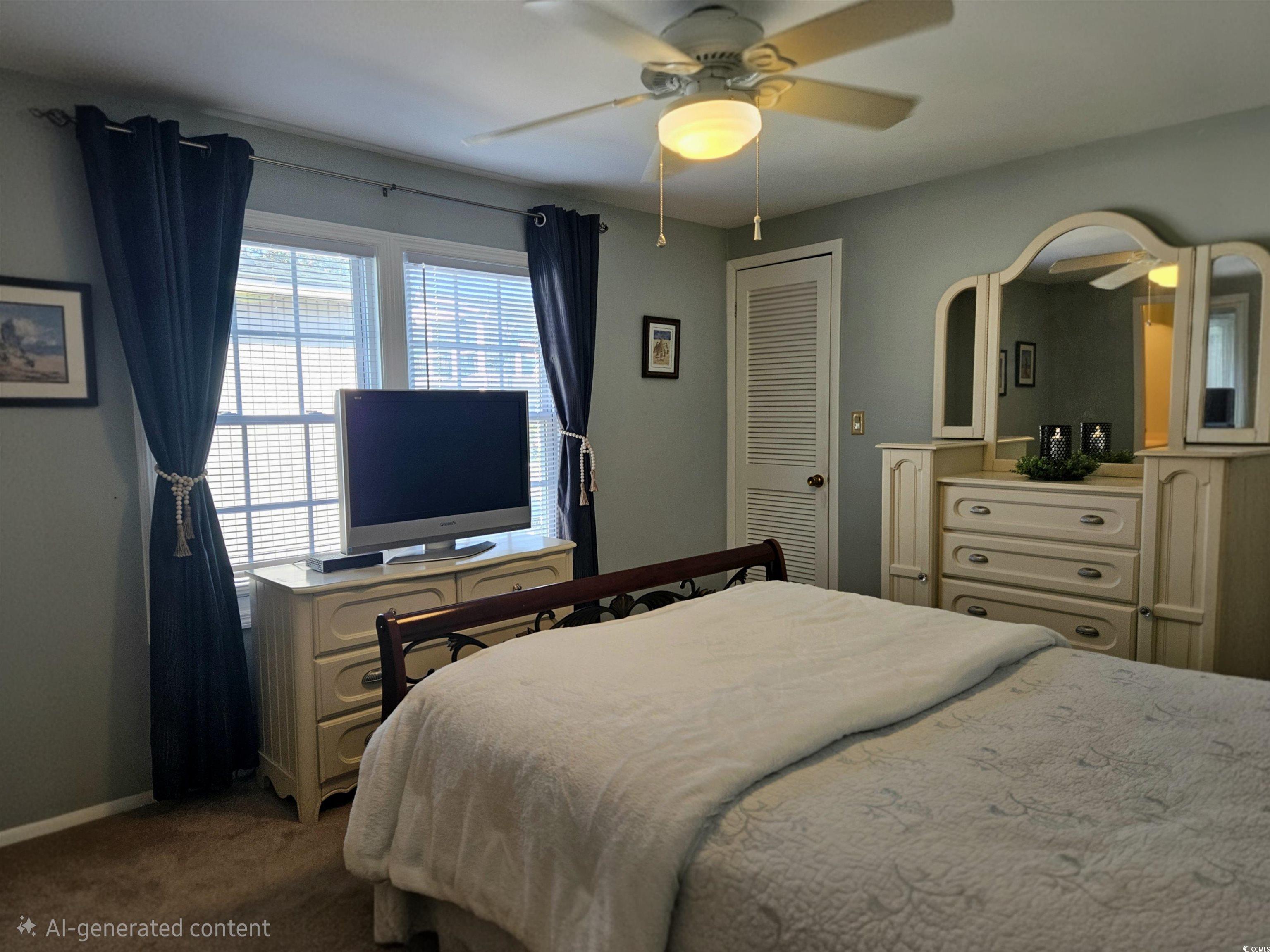 471 Meadowlark Surfside Beach, SC 29575 - Photo 17 of 40 Carpeted bedroom featuring ceiling fan and baseboards