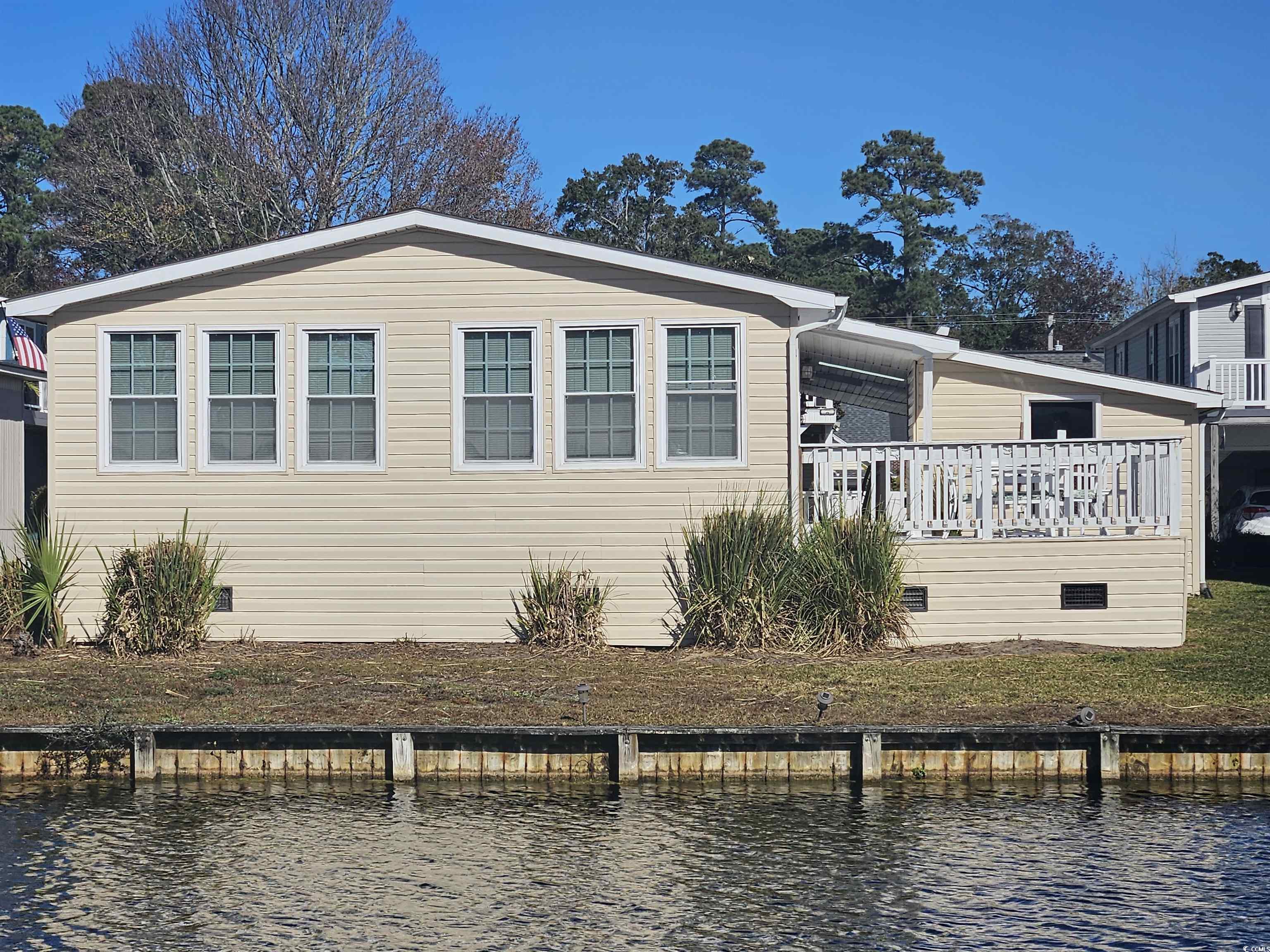 471 Meadowlark Surfside Beach, SC 29575 - Photo 26 of 40 View of back of property with a deck with water view