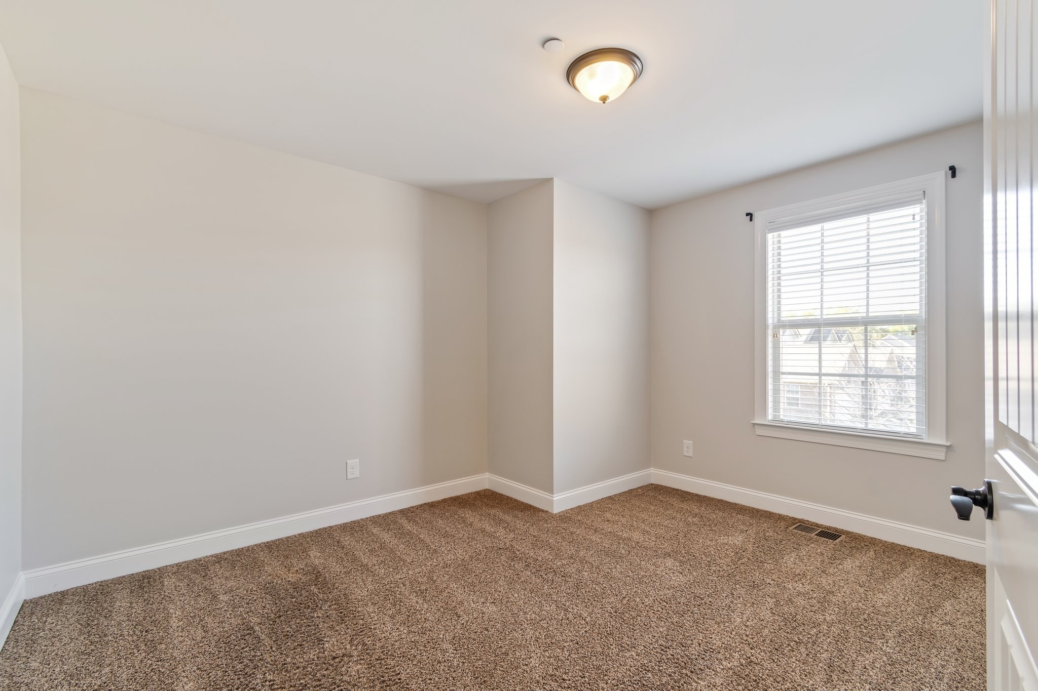 1041 Irish Way Spring Hill, TN 37174 - Photo 27 of 38 an empty room with a empty space and windows