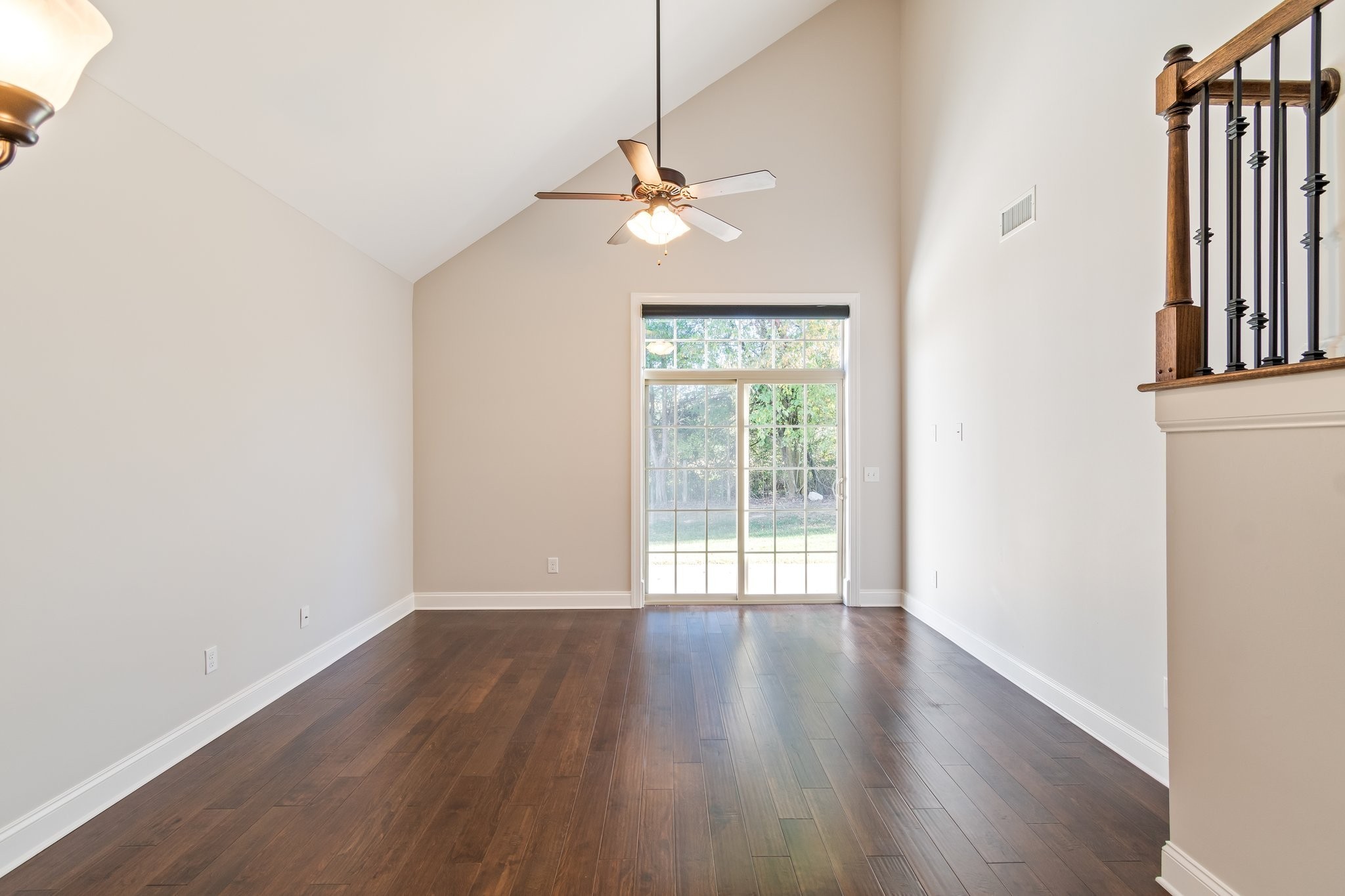1041 Irish Way Spring Hill, TN 37174 - Photo 9 of 38 wooden floor in an empty room with a window