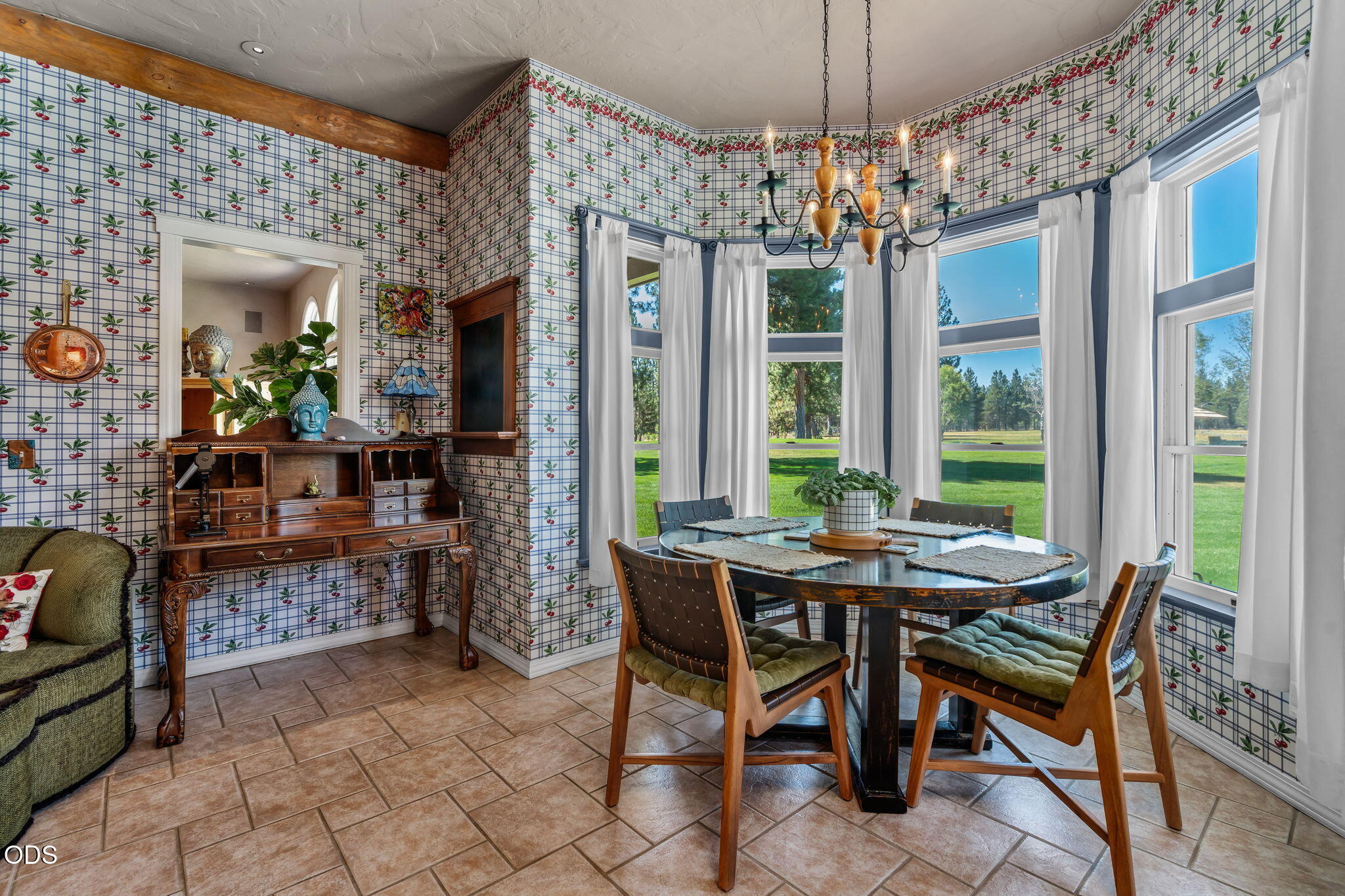 67376 Peterson Mill Road Sisters, OR 97759 - Photo 17 of 72 a dining room with furniture a chandelier and window
