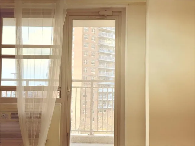 a view of a large window with a small yard