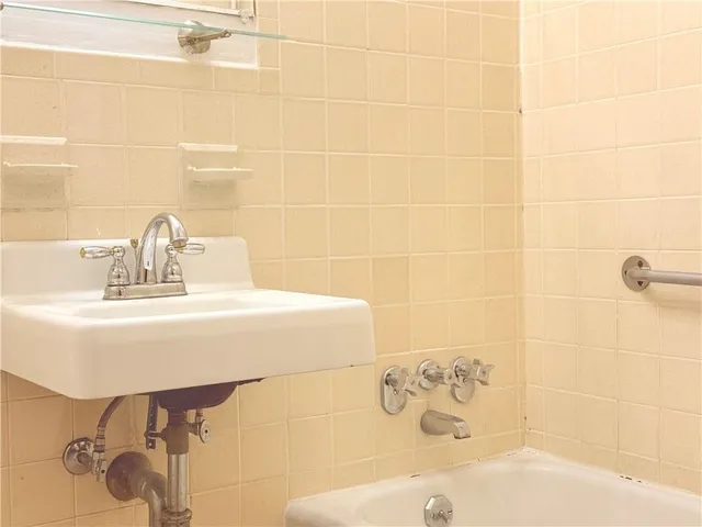 a bathroom with a sink and mirror