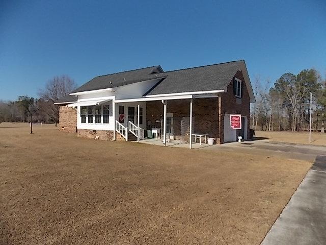 349 Duncan Chapel Road Harleyville, SC 29448 - Photo 4 of 30 BACK-COVERED PATIO & SUN RM